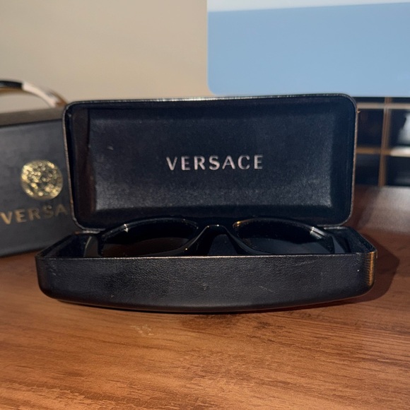 Versace Black and Gold Sunglasses with Iconic Medusa Emblem - Picture 4 of 7
